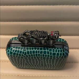 Elegant Green Clutch with Unique skeleton Handle